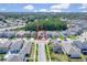 Aerial view of homes showcasing the neighborhood and surrounding trees at 2487 Empress Dr, Kissimmee, FL 34741