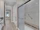 Bathroom featuring a glass-enclosed shower and neutral tones at 2487 Empress Dr, Kissimmee, FL 34741