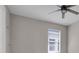 An empty bedroom featuring a ceiling fan and neutral-colored walls at 2487 Empress Dr, Kissimmee, FL 34741