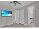 Spacious bedroom featuring tile floors, a ceiling fan, and double door closet at 2487 Empress Dr, Kissimmee, FL 34741
