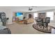 Large bonus room with ample seating, a TV, and a ceiling fan at 2487 Empress Dr, Kissimmee, FL 34741