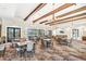 Clubhouse interior with tables, chairs, chandeliers and ample natural lighting at 2487 Empress Dr, Kissimmee, FL 34741
