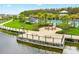 Beautiful community pool area with seating, splash pad and grilling area by the lake at 2487 Empress Dr, Kissimmee, FL 34741
