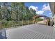 A spacious deck area features wooden railings, and a covered pergola at 2487 Empress Dr, Kissimmee, FL 34741