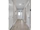 Bright entryway with tile flooring, white doors, and a decorative mirror at 2487 Empress Dr, Kissimmee, FL 34741
