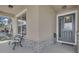 Inviting front porch with stone accents, a decorative front door, and a comfortable bench at 2487 Empress Dr, Kissimmee, FL 34741