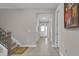 A well-lit hallway showcasing tile floors and stairs to the left at 2487 Empress Dr, Kissimmee, FL 34741