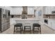 Modern kitchen with stainless steel appliances, granite countertops, and a center island at 2487 Empress Dr, Kissimmee, FL 34741