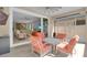 A covered patio showcases outdoor seating and a view into a living area with modern decor at 2487 Empress Dr, Kissimmee, FL 34741