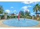 A community splash pad area with colorful water features and surrounding green space at 2487 Empress Dr, Kissimmee, FL 34741