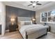 Elegant bedroom featuring a tufted headboard, wainscotting, and ample natural light at 2503 Yellow Brick Rd, St Cloud, FL 34772