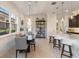 Modern dining area adjacent to the kitchen and entrance with a modern light fixture at 2503 Yellow Brick Rd, St Cloud, FL 34772