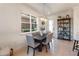 Bright dining area featuring a modern light fixture, and access to the entryway at 2503 Yellow Brick Rd, St Cloud, FL 34772