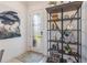 Inviting foyer featuring tile floors, decorative shelving and stylish decor at 2503 Yellow Brick Rd, St Cloud, FL 34772