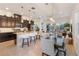 Open concept kitchen with island and stools, transitioning to the dining area and living room at 2503 Yellow Brick Rd, St Cloud, FL 34772