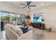 Bright living room with comfy seating and a large sliding glass door to the screened lanai at 2503 Yellow Brick Rd, St Cloud, FL 34772