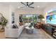 Bright living room with comfy seating and a large sliding glass door to the screened lanai at 2503 Yellow Brick Rd, St Cloud, FL 34772