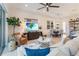 Bright living room open to the dining area with comfy seating and stylish decor at 2503 Yellow Brick Rd, St Cloud, FL 34772