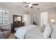 Spacious main bedroom features a ceiling fan, dresser with mirror, and plush decor at 2503 Yellow Brick Rd, St Cloud, FL 34772