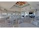 Expansive outdoor kitchen with grills, bar seating, and dining tables is perfect for community gatherings and events at 2503 Yellow Brick Rd, St Cloud, FL 34772
