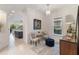 Cozy sitting area with stylish furniture, modern art, and natural light from the window at 2503 Yellow Brick Rd, St Cloud, FL 34772