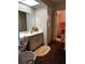 Bathroom featuring sink with vanity, rug and louvered door closet, and adjacent toilet at 2659 Crown Ct # 11, Kissimmee, FL 34741