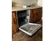 A modern dishwasher with an open door displaying an organized rack system at 2659 Crown Ct # 11, Kissimmee, FL 34741
