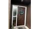 A charming front door with sidelight, decorative wreath, and welcome mat at 2659 Crown Ct # 11, Kissimmee, FL 34741