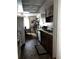 Charming kitchen featuring wood cabinetry, tile floors, and adjacent dining area at 2659 Crown Ct # 11, Kissimmee, FL 34741