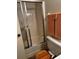 Bathroom shower and toilet area with sliding glass door at 2659 Crown Ct # 11, Kissimmee, FL 34741