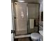 Bathroom shower with sliding glass door and built-in shower head at 2659 Crown Ct # 11, Kissimmee, FL 34741
