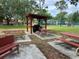 Exterior of a picnic area with picnic tables and a grill at 2804 N Powers Dr # 31, Orlando, FL 32818