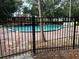 Exterior shot of a pool with a brick deck and a fence at 2804 N Powers Dr # 31, Orlando, FL 32818