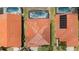 Aerial view of several homes with orange tile roofs and private pools at 301 Rosso Dr, Davenport, FL 33837