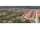 A high-angle view of a neighborhood with orange tile roofs at 301 Rosso Dr, Davenport, FL 33837