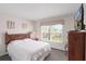 Comfortable bedroom with natural light and a TV on the dresser at 301 Rosso Dr, Davenport, FL 33837