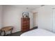 This cozy bedroom has a TV on the dresser and a comfortable bed at 301 Rosso Dr, Davenport, FL 33837