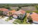 Inviting home featuring lush landscaping, a two-car garage, and a charming entrance at 301 Rosso Dr, Davenport, FL 33837