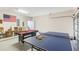 Spacious game room with ping pong and billiard tables, offering entertainment options at 301 Rosso Dr, Davenport, FL 33837