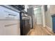 A kitchen featuring stainless steel appliances, white cabinets, and wood-look flooring at 3038 Parkway Blvd # 204, Kissimmee, FL 34747