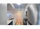 Updated kitchen with modern stainless appliances, granite countertops, and wood flooring at 3038 Parkway Blvd # 204, Kissimmee, FL 34747