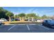 Well-organized parking lot with several parked cars on a sunny day at 3038 Parkway Blvd # 204, Kissimmee, FL 34747