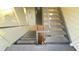 Stairwell with gray stairs, brown tiles, and neutral walls with natural lighting at 3038 Parkway Blvd # 204, Kissimmee, FL 34747