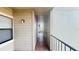 Outdoor walkway to a condo unit with a railing and overhead protection at 3038 Parkway Blvd # 204, Kissimmee, FL 34747