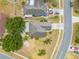 Aerial view highlighting the property with a large lawn, and mature trees at 3160 Santa Cruz Dr, Kissimmee, FL 34746