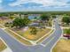 Aerial view showcasing the home's location near a scenic lake and lush surroundings at 3160 Santa Cruz Dr, Kissimmee, FL 34746