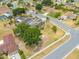 Aerial view of a home in a well-established neighborhood with mature trees at 3160 Santa Cruz Dr, Kissimmee, FL 34746