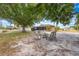 Inviting backyard with sandy area and seating area, perfect for relaxing outdoors at 3160 Santa Cruz Dr, Kissimmee, FL 34746