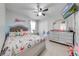 Well-lit bedroom with a modern bed, dresser, and TV, perfect for a  at 3160 Santa Cruz Dr, Kissimmee, FL 34746