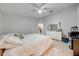 Bedroom features a ceiling fan, a dresser, and tile floors at 3160 Santa Cruz Dr, Kissimmee, FL 34746